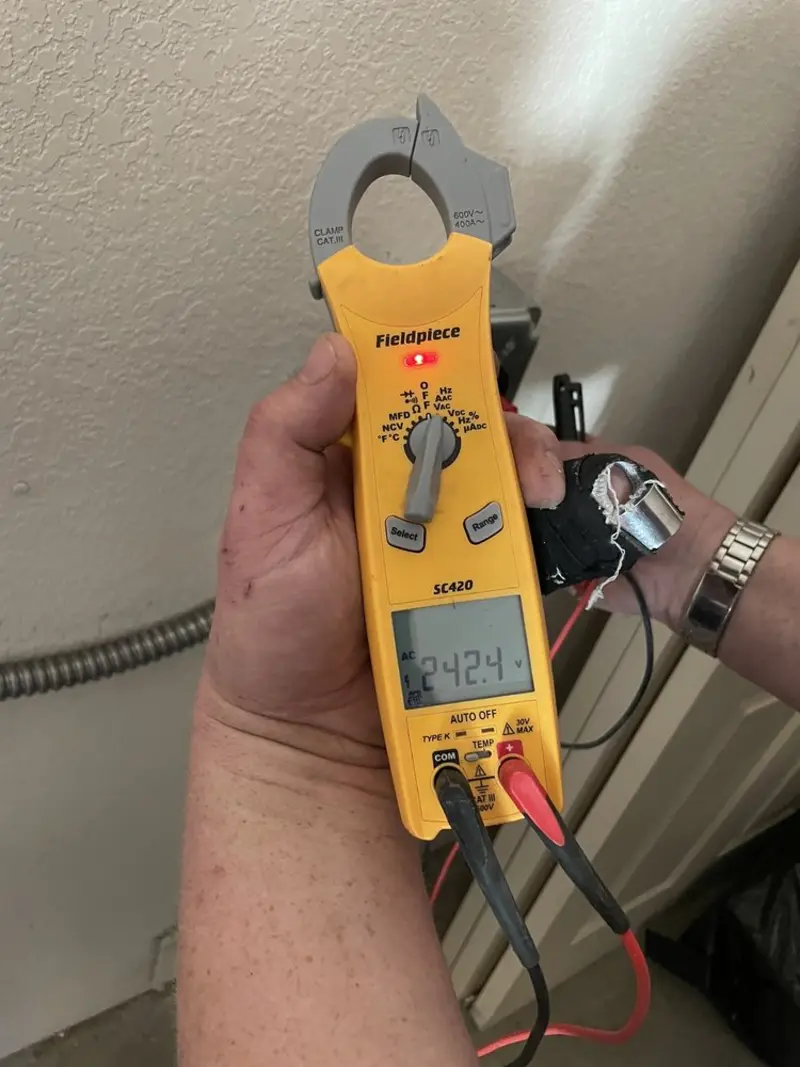 Voltage testing with clamp meter during Generator Installation in Clay Center